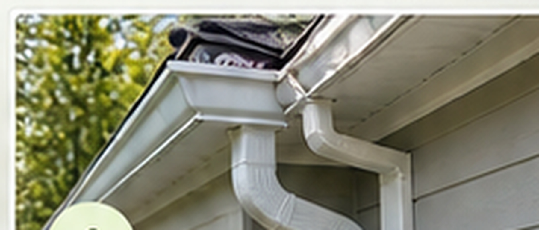 Professional technician securing gutter brackets and sealing joint leak